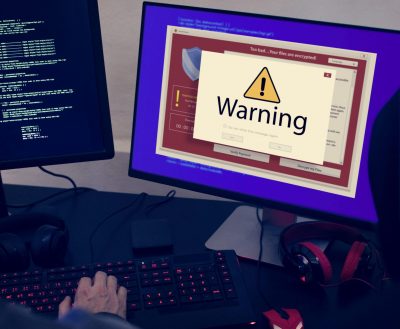 computer with warning pop-up sign window